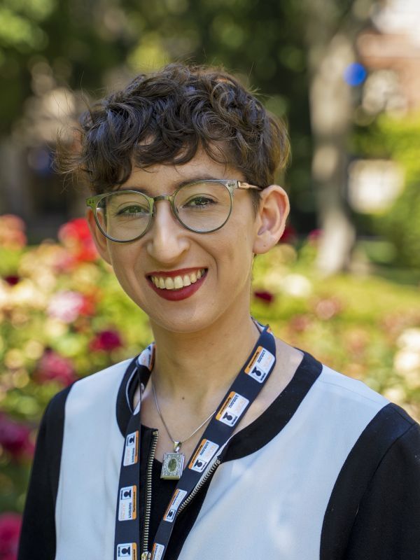 Headshot of Gillian Goldberg in front of rose garden