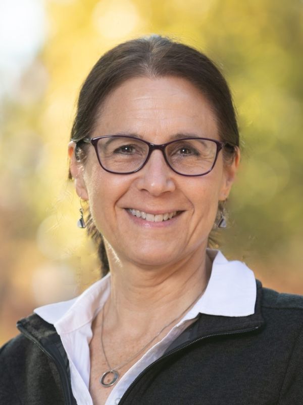 The image shows the smiling face of Dr. Lynnea Marie LoPresto. She is wearing a blue shirt. 