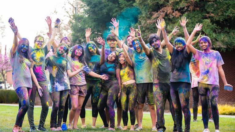 students celebrate holi