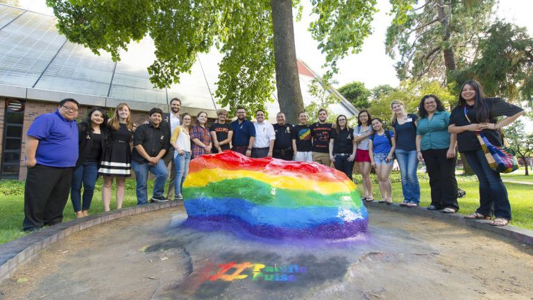 Students painting the Rock