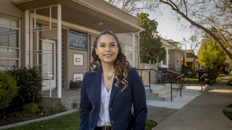 McGeorge 3L and Immigration Law Clinic student Erika Patty Muñoz outside the McGeorge Community Legal Services building