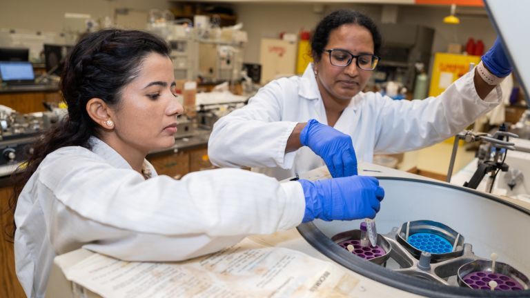 Two students in research lab