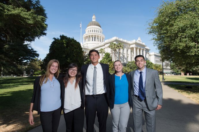 Students standing in front of Capitol building 