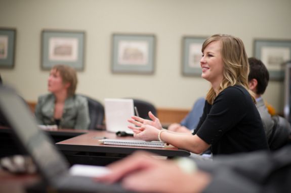 Woman smiling in class. 