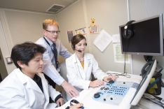 AuD students using equipment in clinic