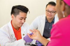  PharmD student with patient at clinic