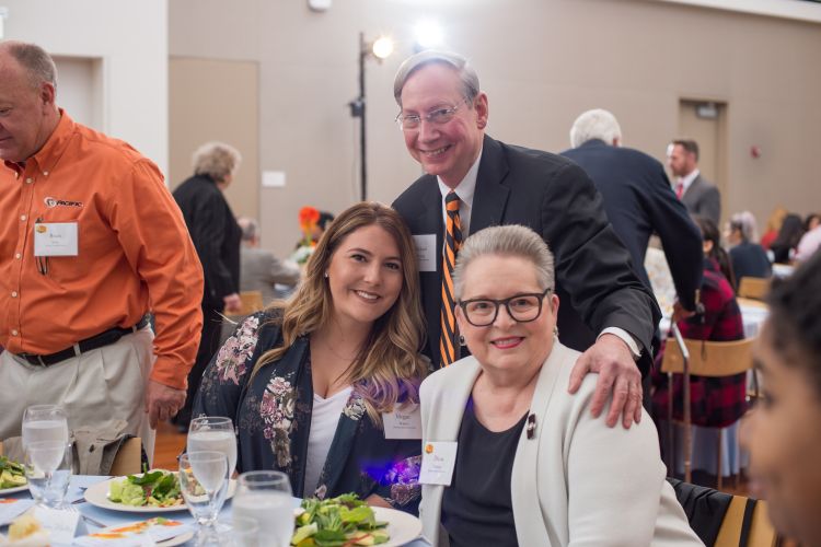 Photo of scholarship recipient with Rick and Diana Fleming