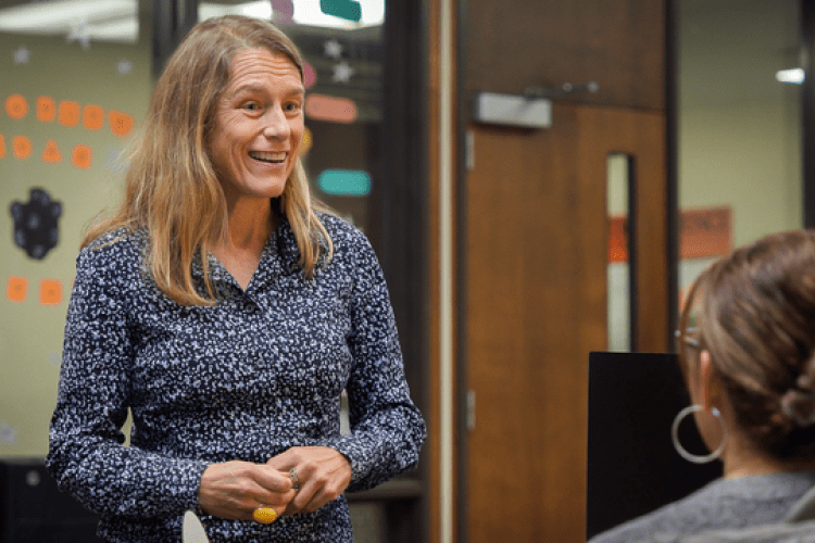 Lee Skinner talks to a staff member in College of the Pacific