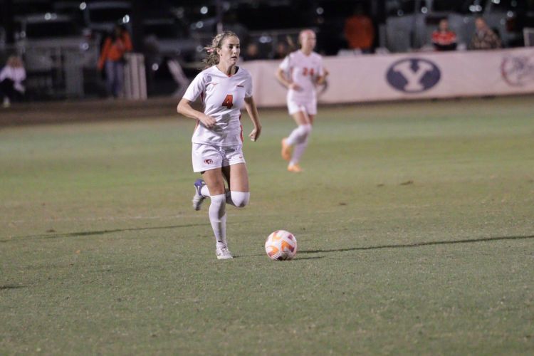 Jenae Packard runs on a soccer field