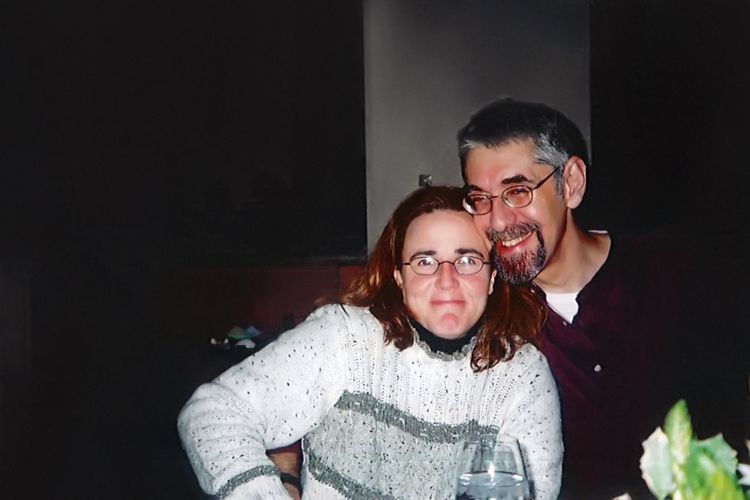 A man and a woman pose for a photo.