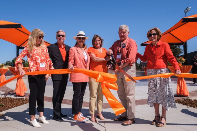 Janet Lucas and university leaders at the ribbon cutting for the football plaza