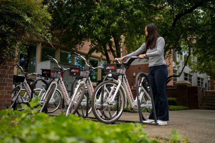 a student selects an e-bike from the on-campus hub