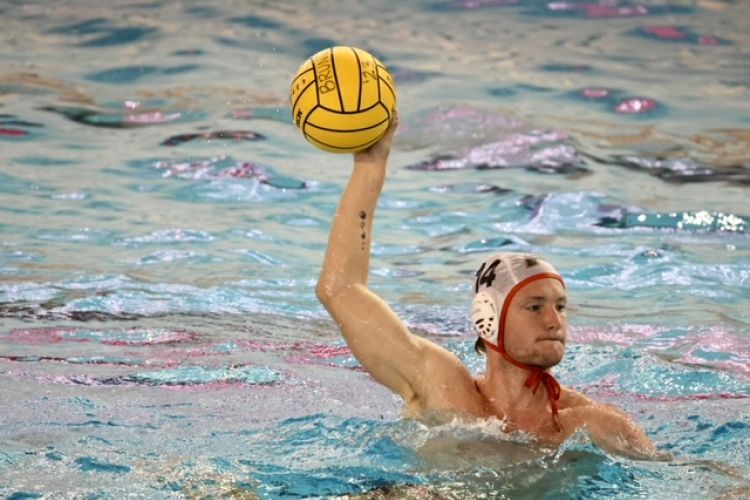 Declan McJilton prepares to throw the ball while playing water polo