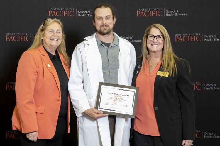 From left to right: Bev LaBelle (Regent Roger's wife), Regent Janet Rogers and 2024-2025 scholarship recipient, Calvin Nauer. 