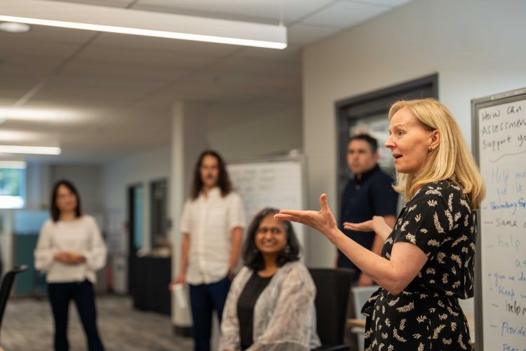 On the right, Leslie Bayers participates in a Faculty Fellows program meeting.