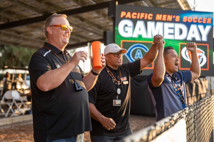 Rob Henderson cheers for the men's soccer team at a recent game