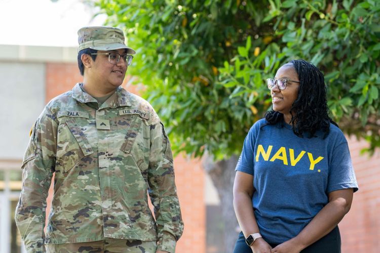 Two student veterans walking on campus