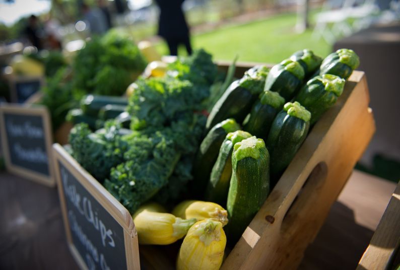 broccoli and zucchini displayed in wooden box