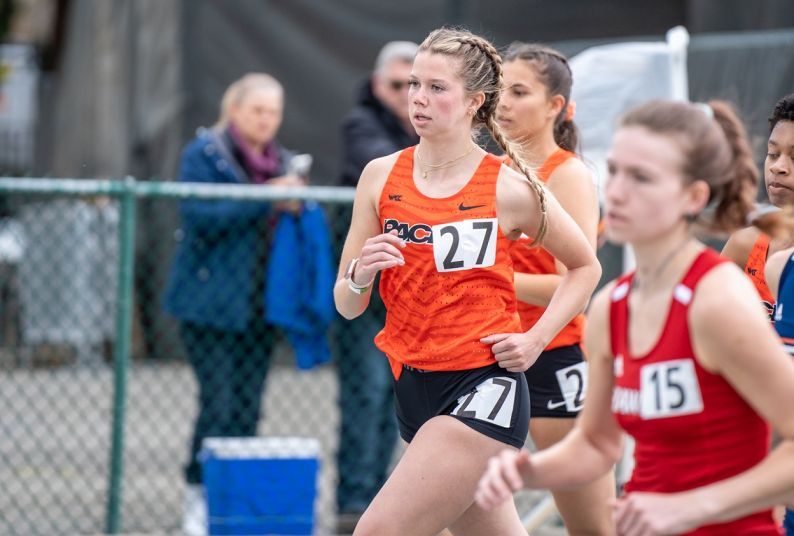 student-athletes running in track competition