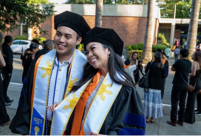 Darrin Baluyot ’23 and Janize Sarmiento ’23 celebrate their graduation at McGeorge School of Law’s Annual Unity Graduation in 2023.