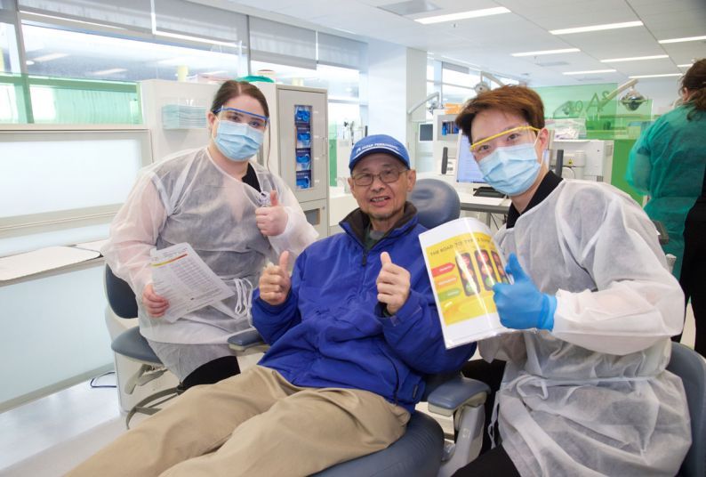 patient giving thumbs up