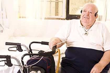 older man with assistive equipment