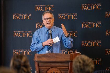 A professor standing at a podium