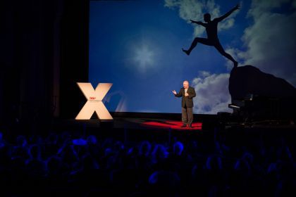 A speaker stands on stage during a previous TEDx event at Pacific.