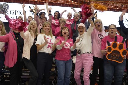 First Lady Jean Callahan with other women leaders at a women's basketball game. 