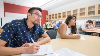 students take notes during class