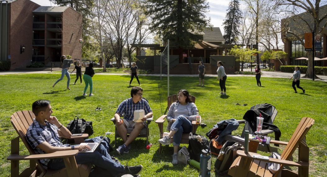 students in the quad with volleyball