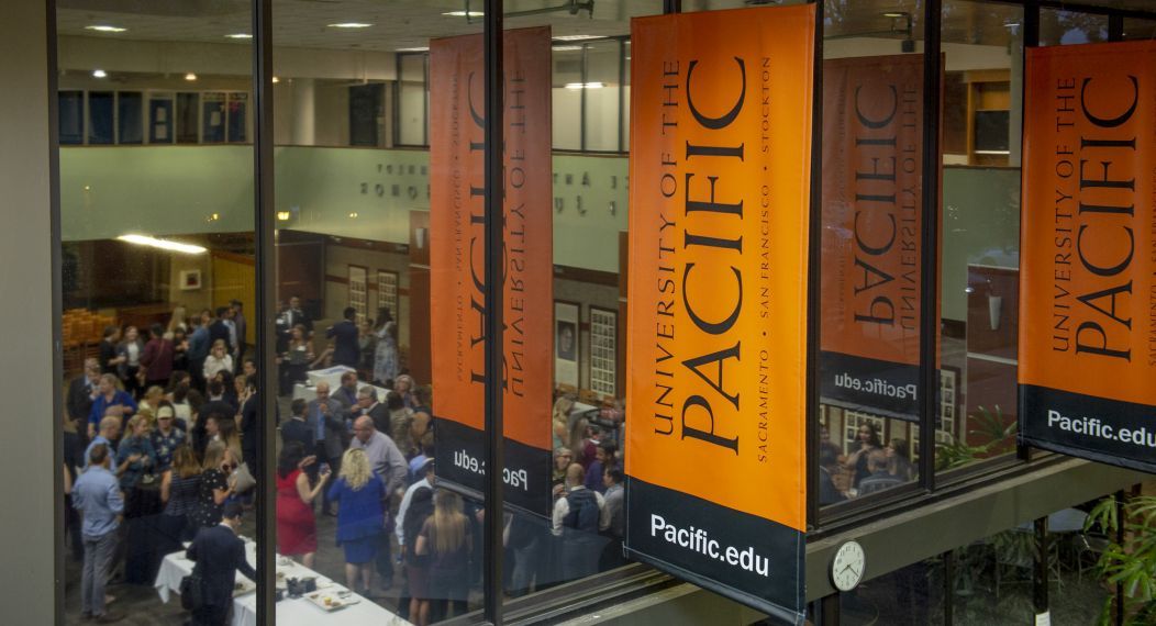 looking through the windows at an event in the student center