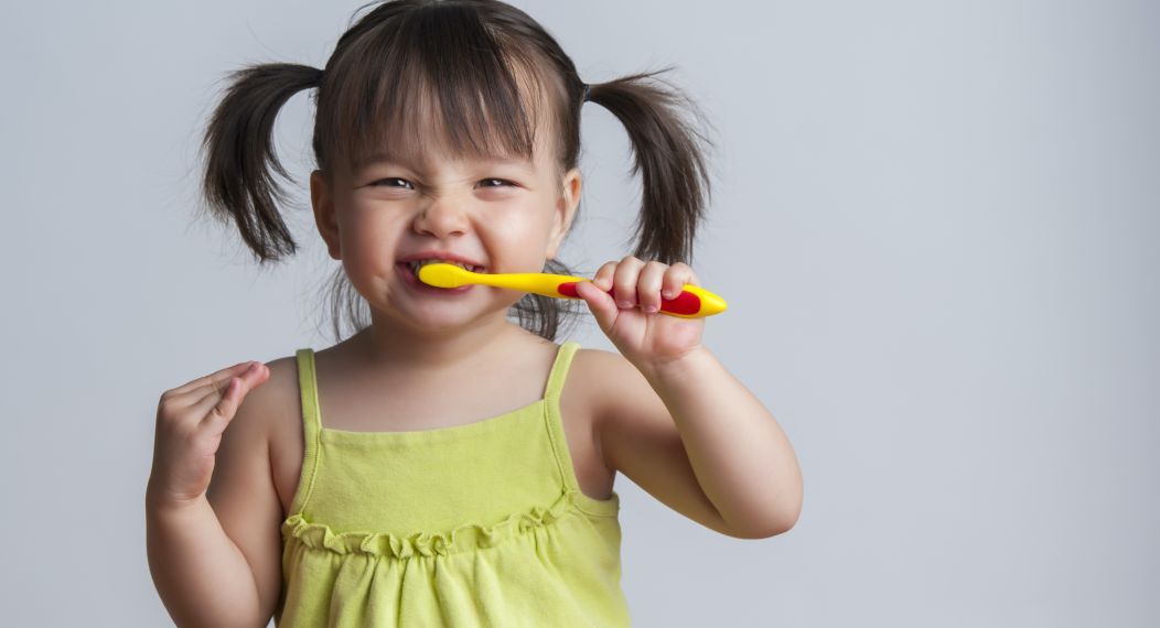 girl with toothbrush