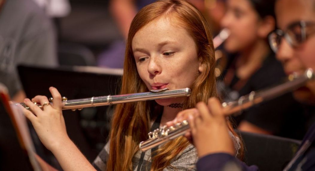 a music camp student playing the flute