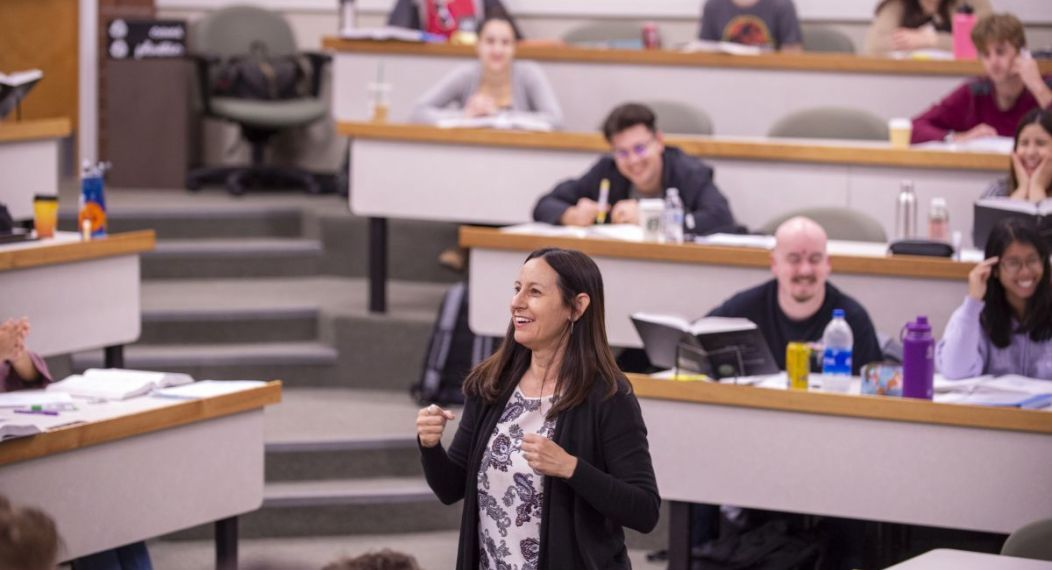 A teacher speaking to a room of students