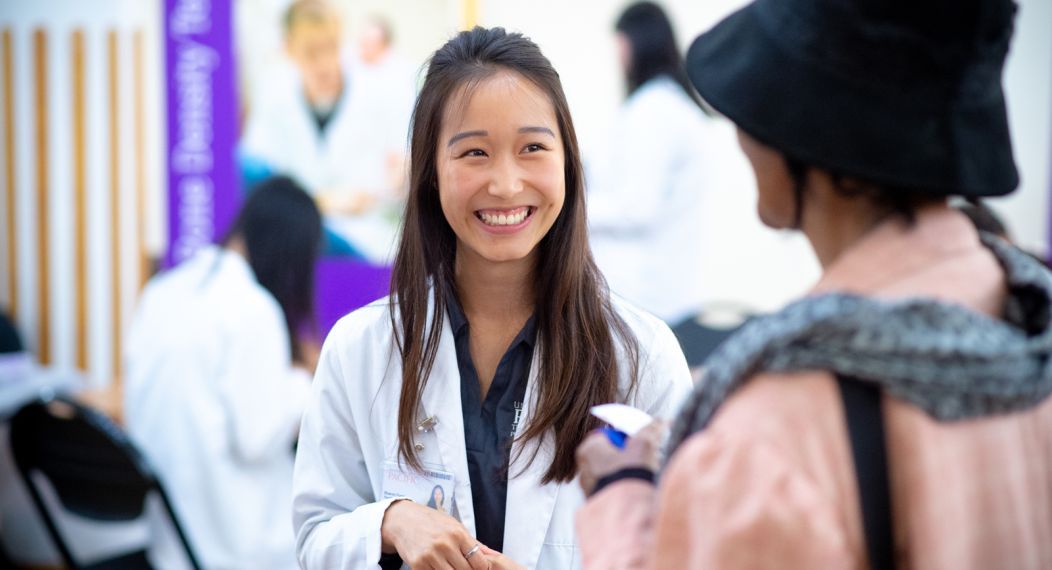 Doctor of pharmacy student with patient at Medicare Part D clinic