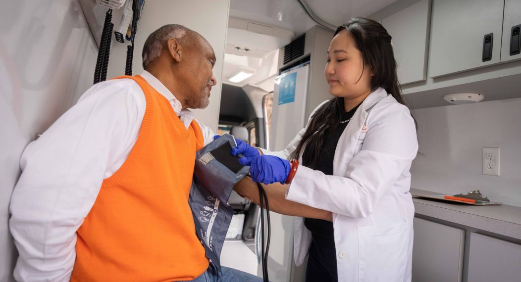 doctor of pharmacy student with patient in mobile clinic van