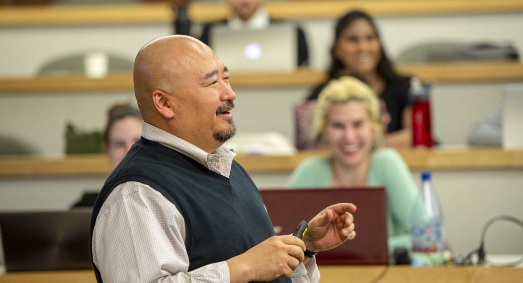 A professor addresses a classroom