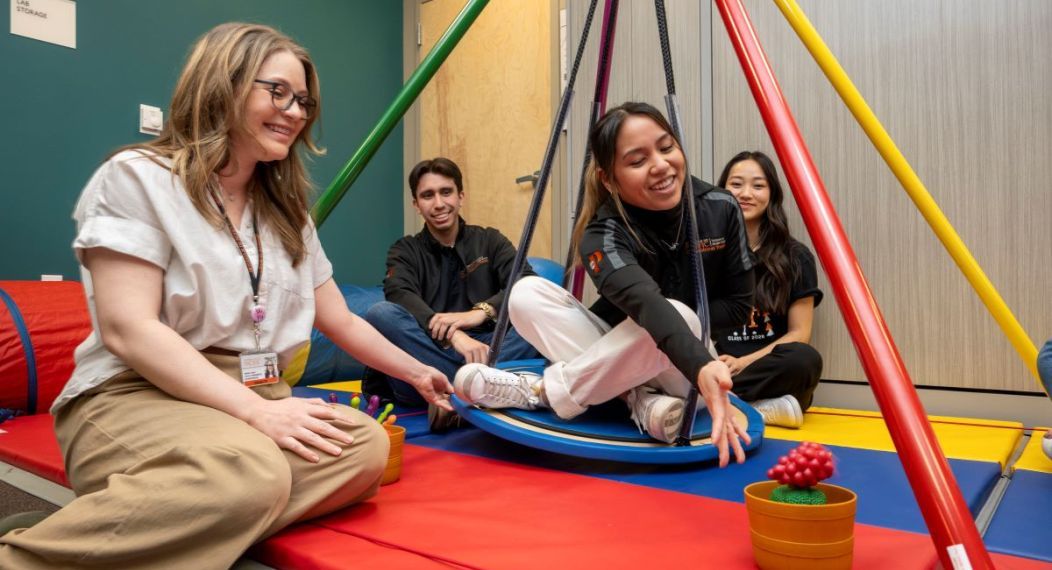 Occupational therapy students use OT tools