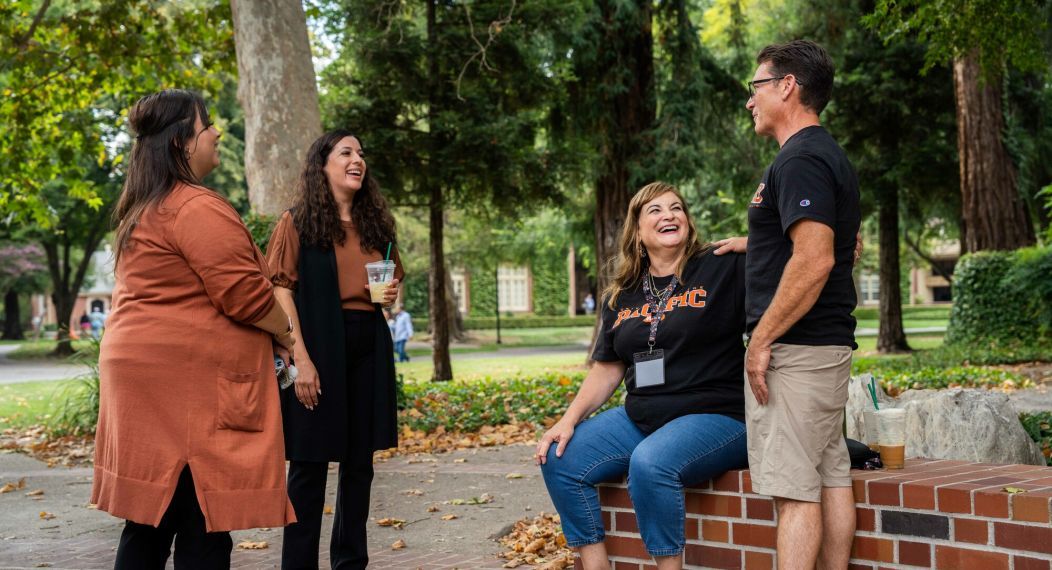 Parents wearing University of the Pacific apparel.