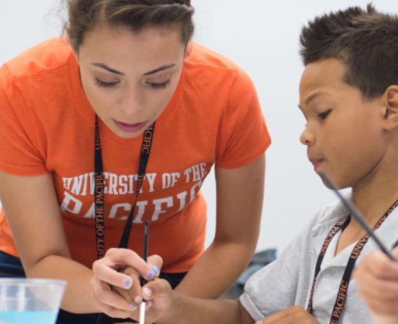 college of the Pacific student with child