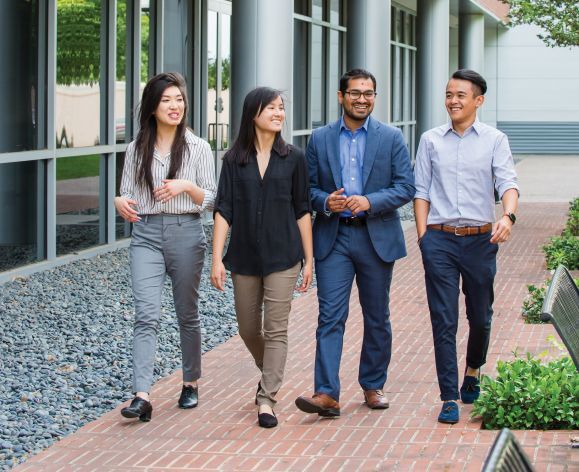 Sachin Shah walks with PharmD students on North Campus