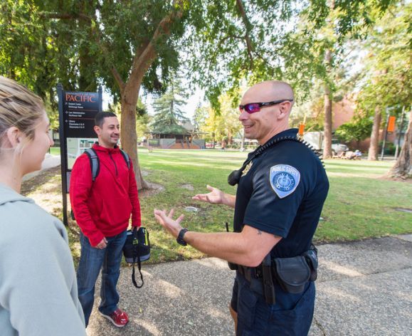 Officer speaking to students