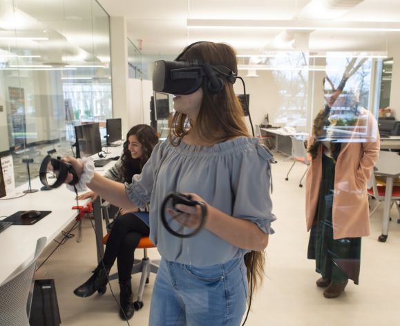 Student using virtual reality headset in the Cube