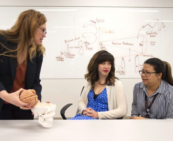 audiology professor with students in classroom