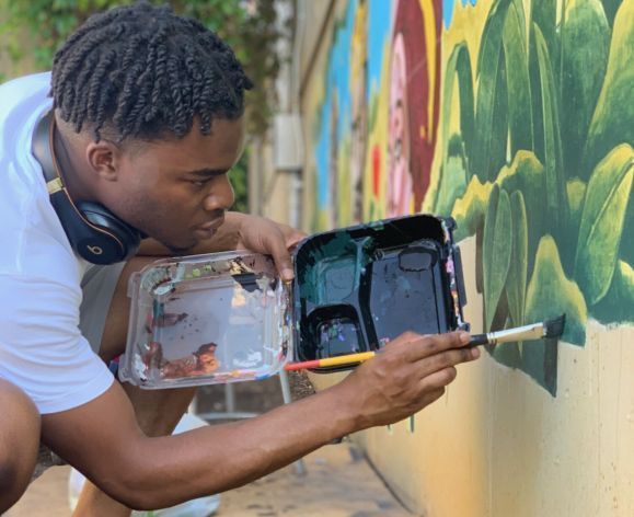 studio art student painting mural