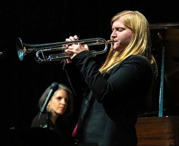 Kate Williams playing her trumpet 