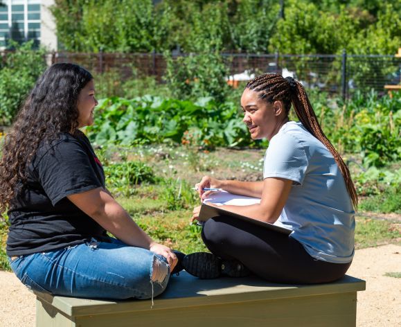 students sitting on bench