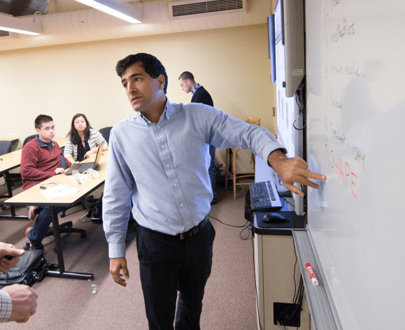 Professor lecturing in an engineering management class