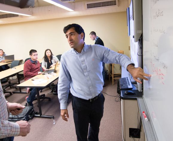 Professor lecturing in an engineering management class